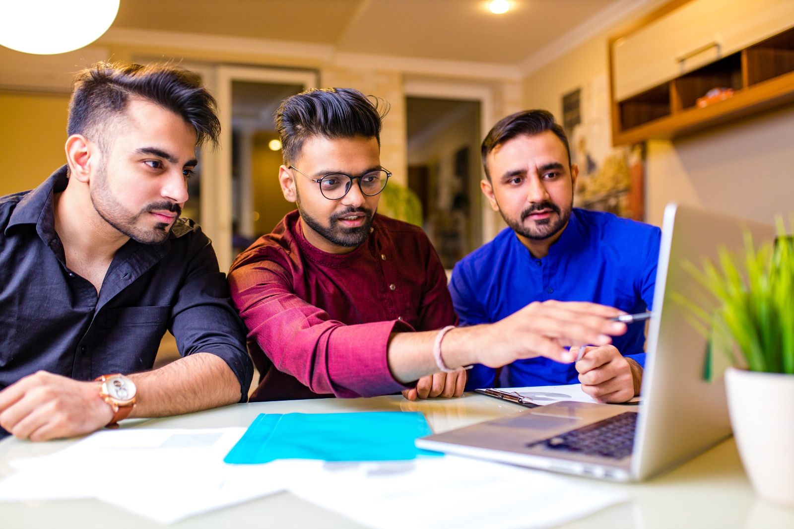 Performance marketing specialists reviewing campaign results on a laptop